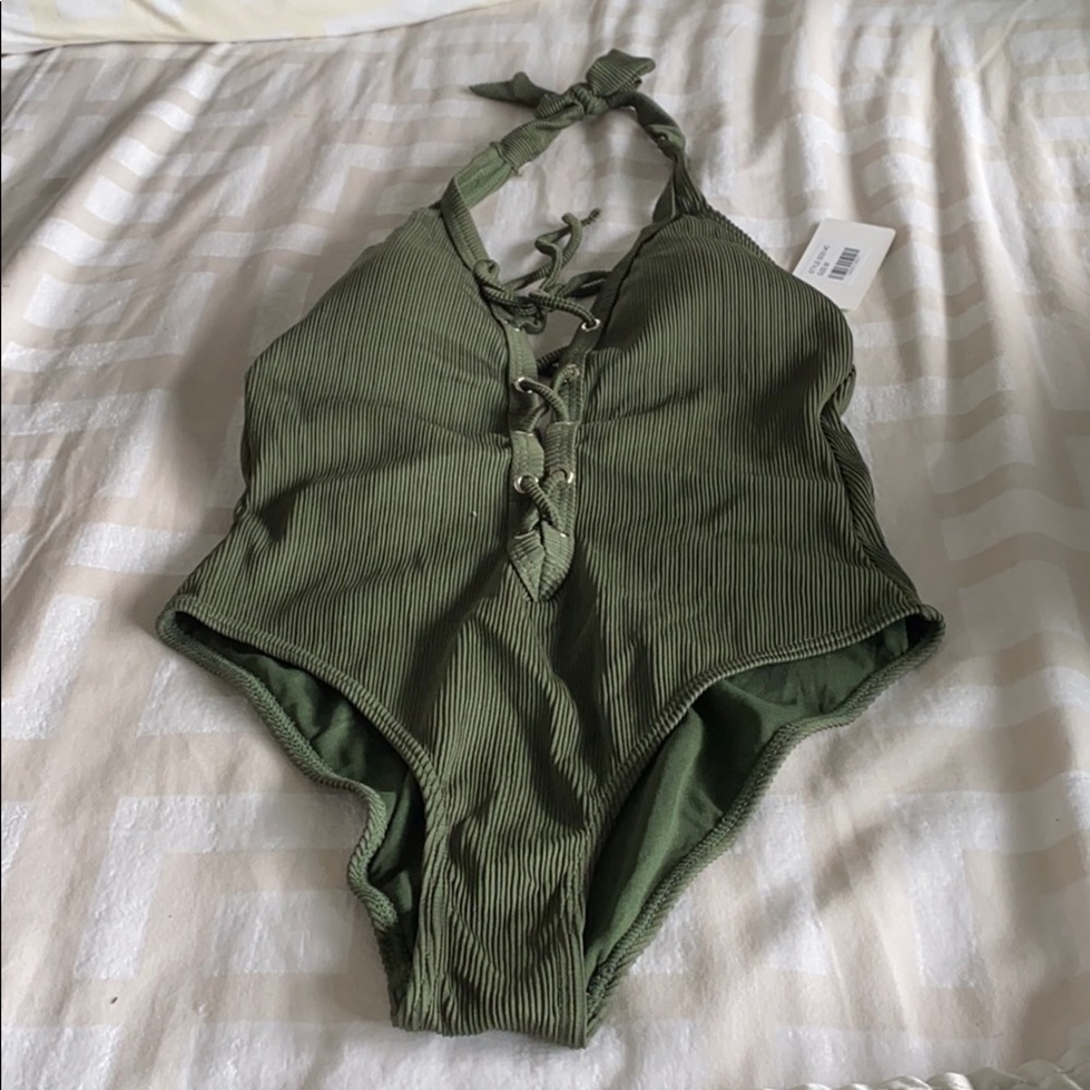 Green one piece swim suite.